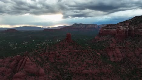 aerial view of red rock mountains of sedona in arizona at sunset - drone shot