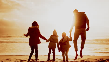 sunset, holding hands and family beach jump