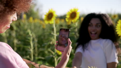 women in a sunflower field