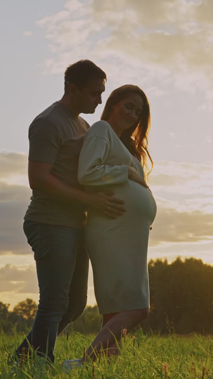 Pregnant Couple at Sunset
