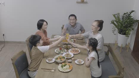 asian family toasting.