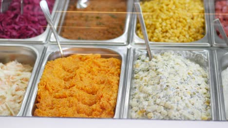 variety of salads and sides at a self-service restaurant