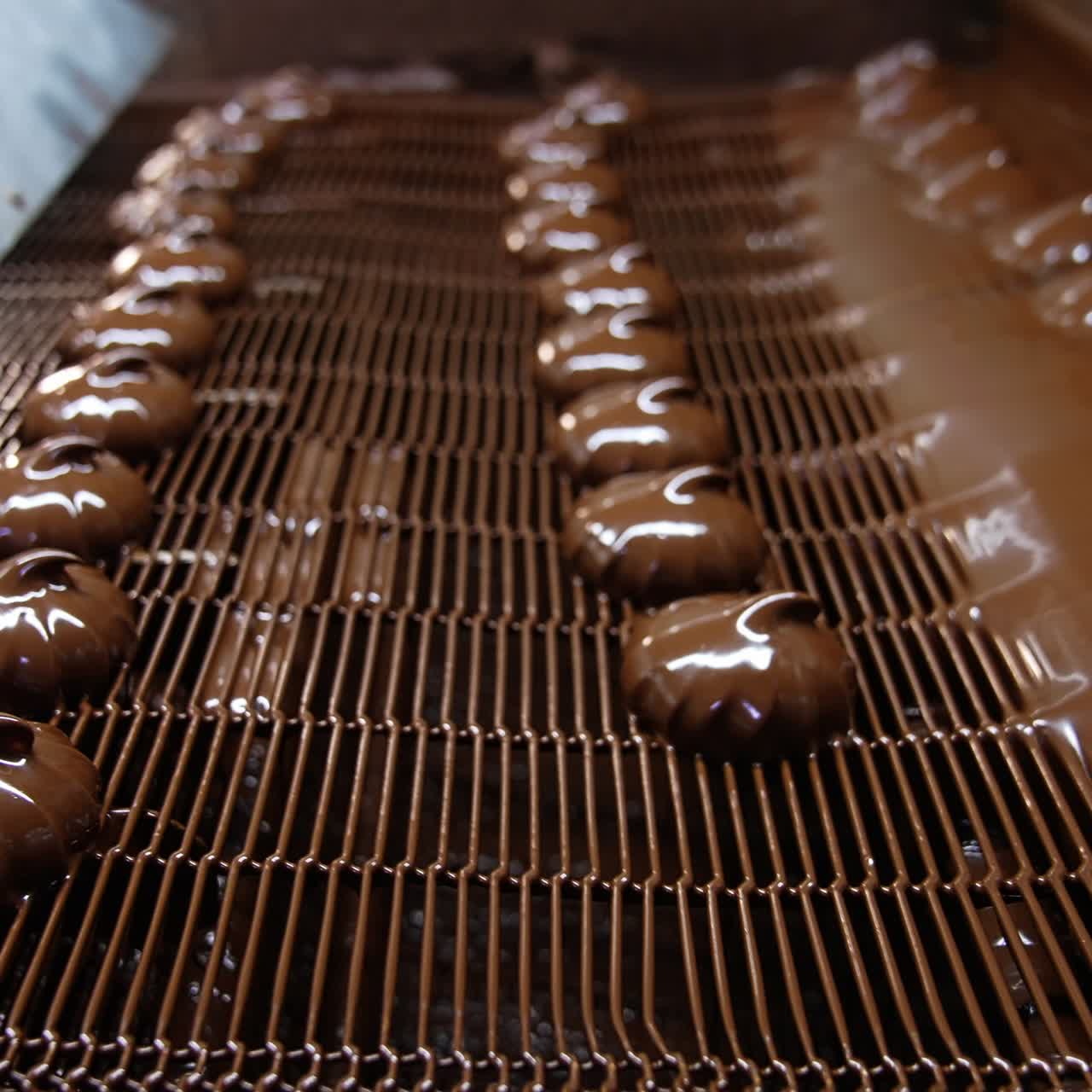 Chocolate Candies on a Conveyor Belt