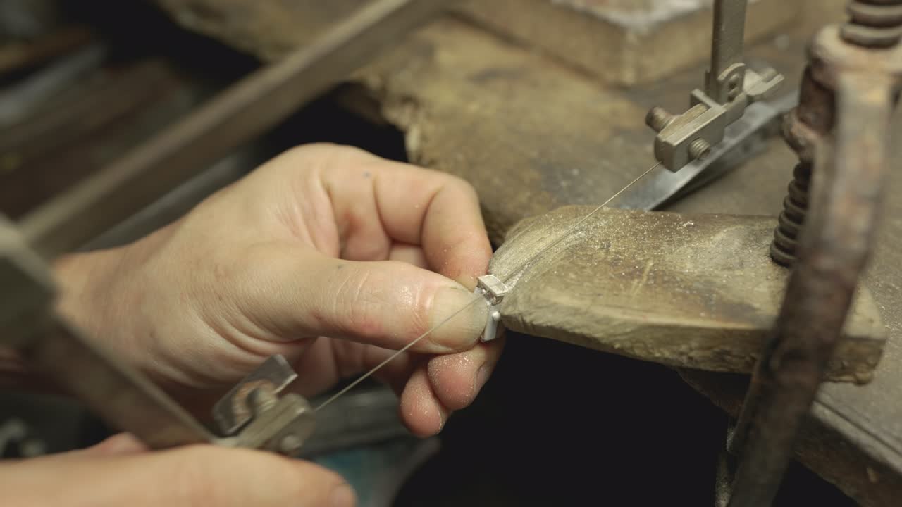Jeweler at work in jewelry. Desktop for craft jewelry making with professional tools. Close up view of tools.