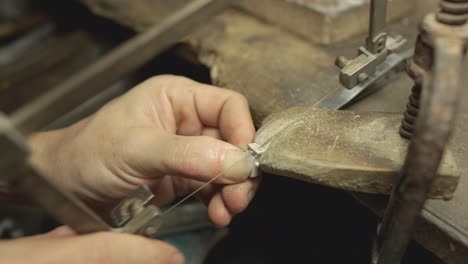 jeweler at work in jewelry. desktop for craft jewelry making with professional tools. close up view of tools.