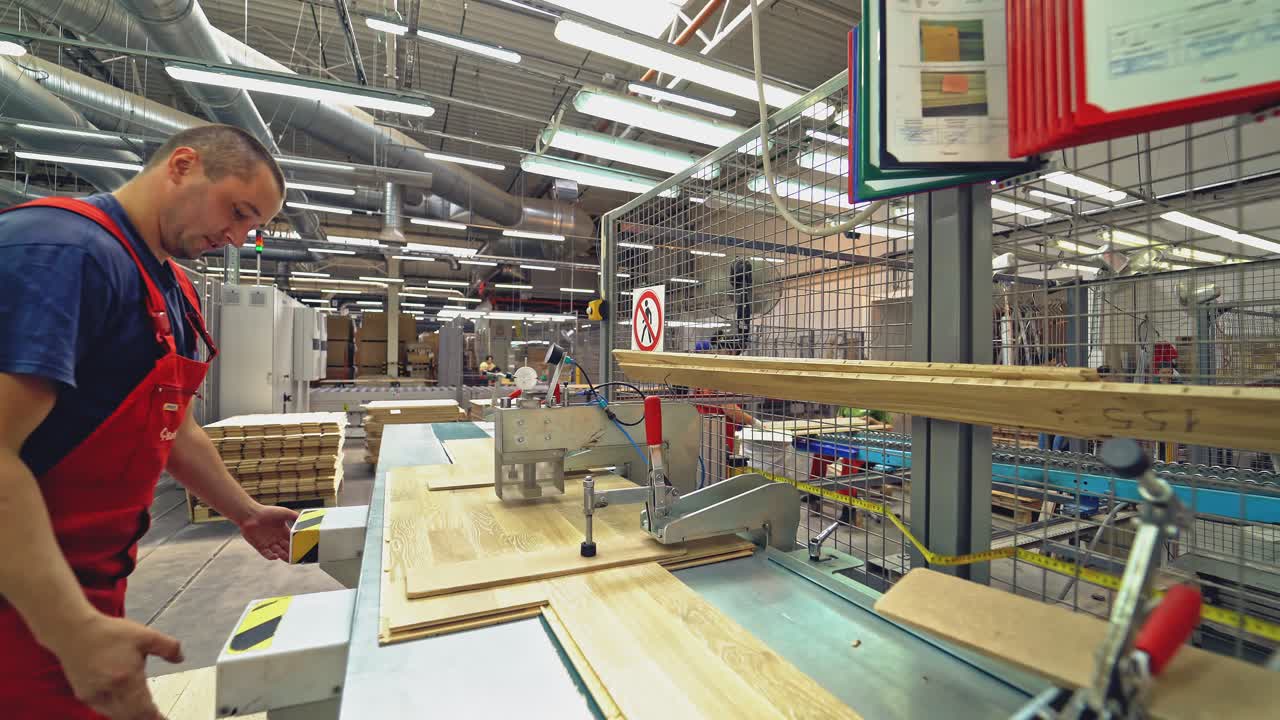 Carpenter working with Industrial tool in wood factory.