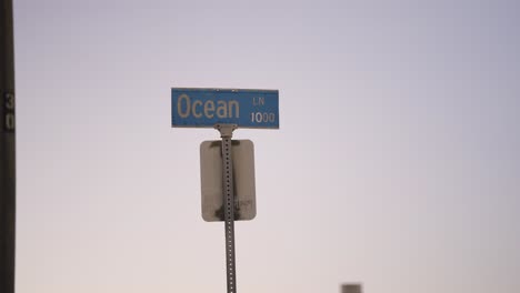 blue ocean lane street sign during sunset in usa