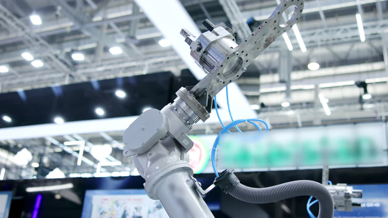 Close-up of a robotic arm in an industrial or exhibition setting
