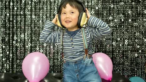 Young-Boy-Playing-With-Balloons-17