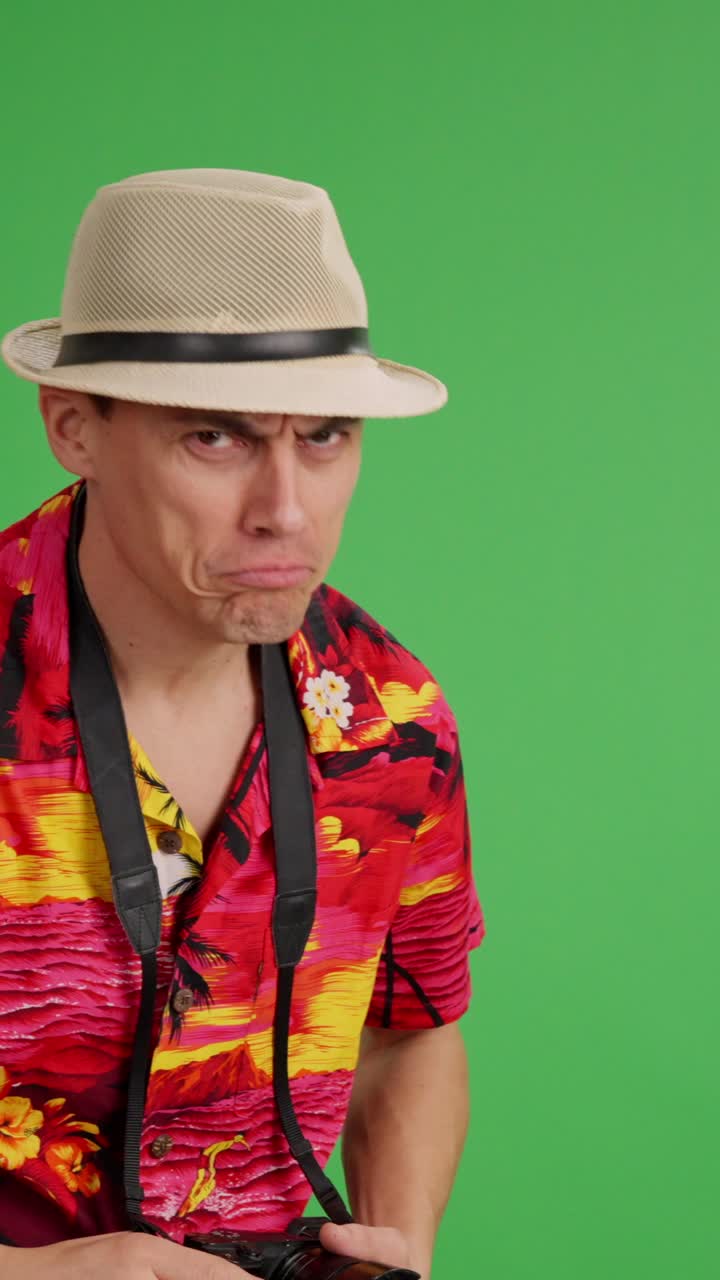 Tourist pointing, looking, and reacting on green screen background