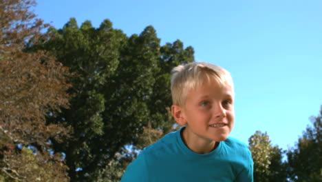 little boy heading a football