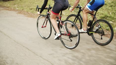 sportive people riding bicycles