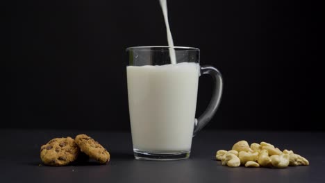 static shot of a jar with cookies and cashew nuts