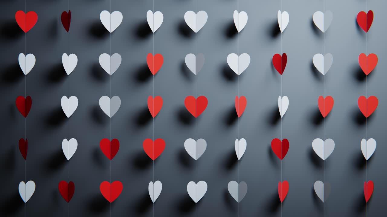 Cuori di carta minimalisti rossi e bianchi che ruotano su fili