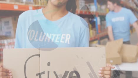 statistical data processing against african american female volunteer holding a placard at warehouse