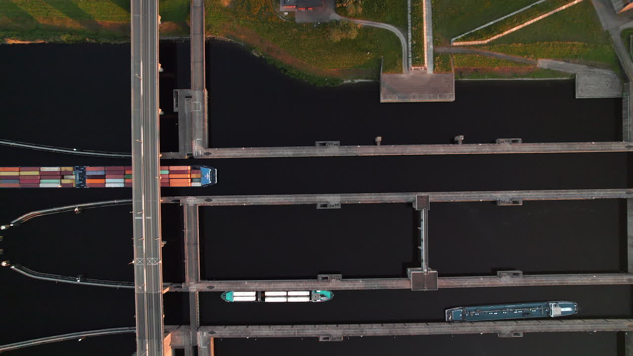 Containership Crossing Under Krammerbrug In Bruinisse, Netherlands. Aerial Topdown Shot