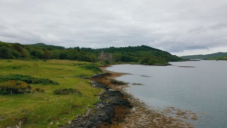 aerial flyover of scottish coast towards dunvegan castle