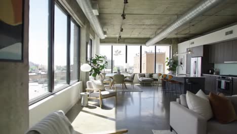 modern urban apartment interior featuring expansive windows and contemporary decor, showcasing a blend of comfort and style with natural light and open space