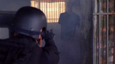 Rear-view-of-caucasian-military-soldier-firing-with-pistol-on-rubber-dummies-during-training-4k