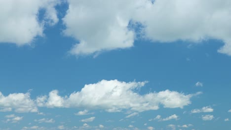 Billowing-summer-clouds-in-front-of-blue-sky,-4k-time-lapse-video