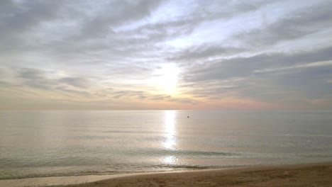 Sunrise-beach.-Idyllic-scene-of-sea-sunrise.-Sea-waves-slowly-splashing-sand