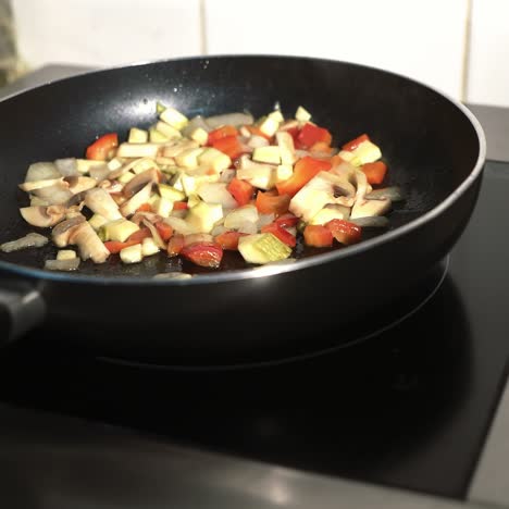 man cooking vegetable stew