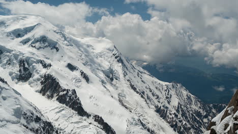 time lapse, low clouds formations above snowy mont blanc and chamonix, france