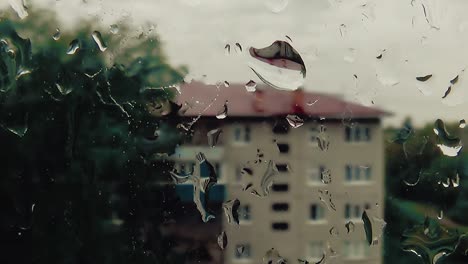 it's raining drops slide down the glass 1