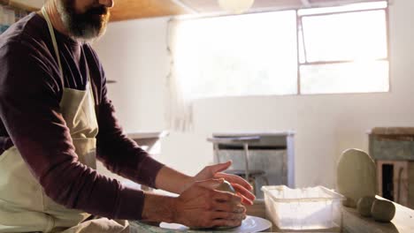 Male-potter-making-pot