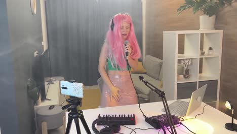 woman singing and recording in a home studio