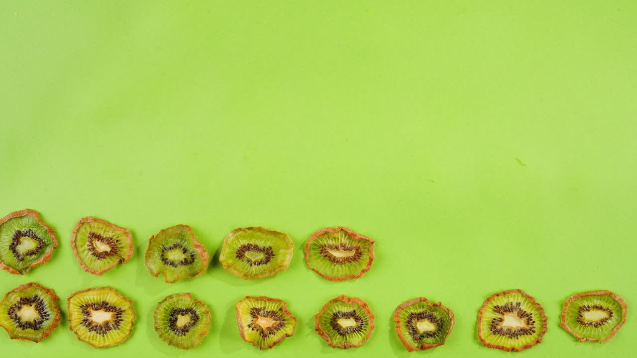 kiwi slices close up background of green, fresh fruit texture.