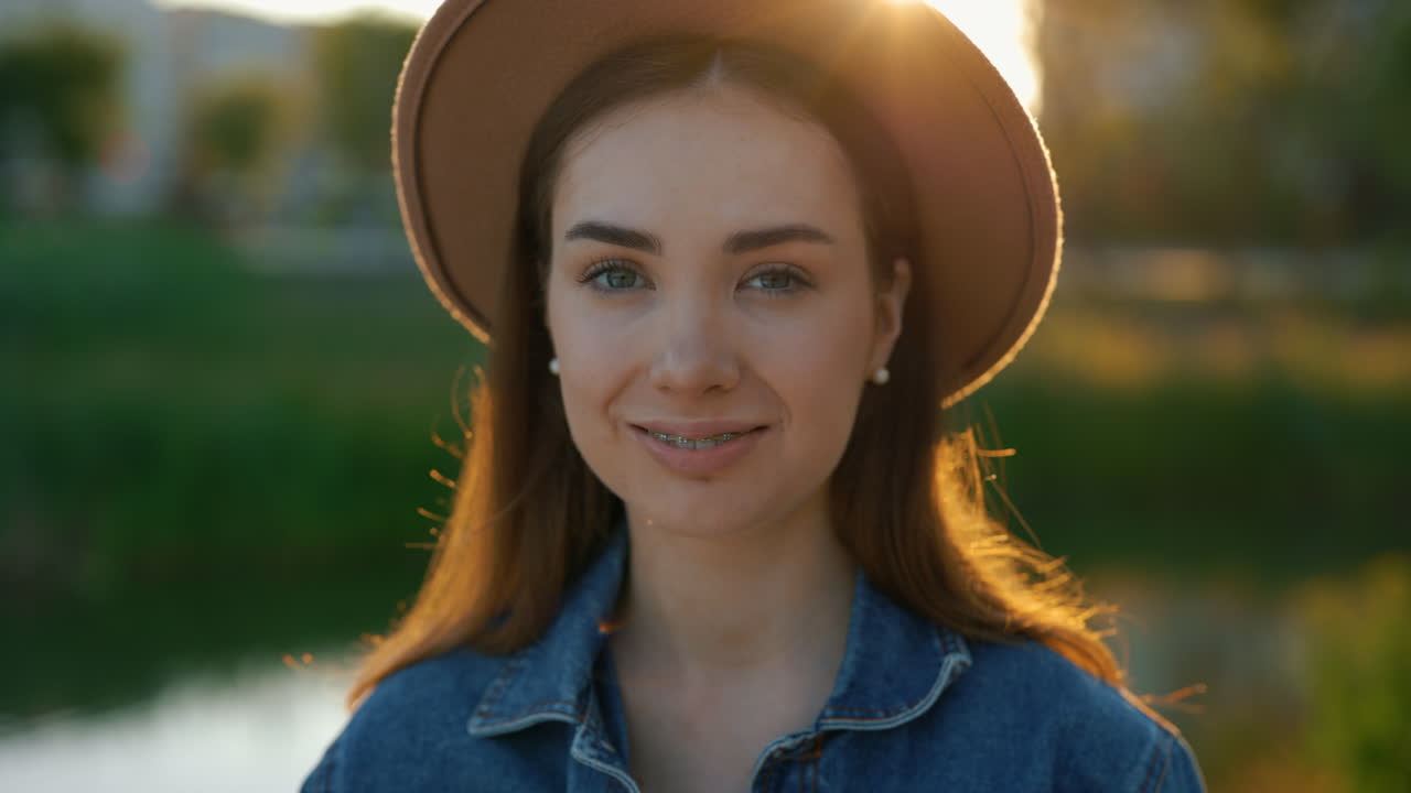 Smiling Woman in a Park at Sunset