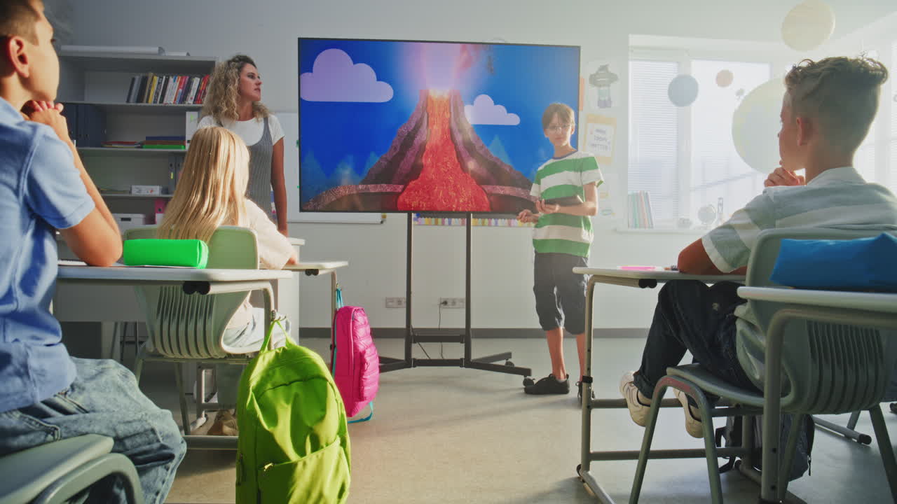 Primary School Boy Showcasing Knowledge Using Digital Screen with Chromakey Mockup