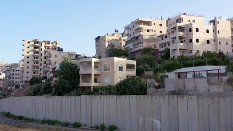 palestine anata refugges camp behind concrete wall -aerial