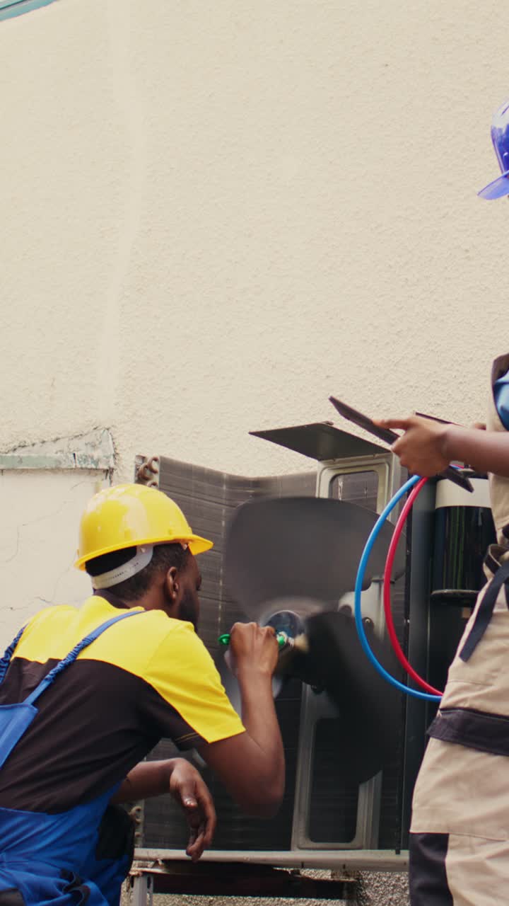 Vertical video Worker cleaning air conditioner coolants