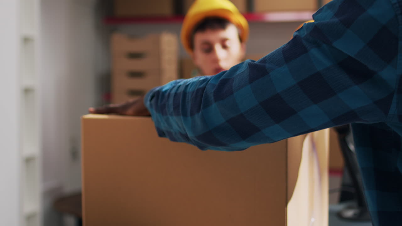 Warehouse workers packaging boxes