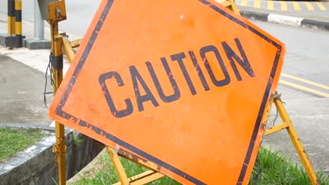 Caution sign on street in singapore
