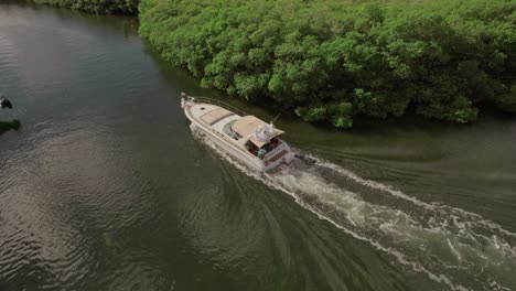 drone shot 4k of a boat in water, cancun, tulum, playa del carmen, mexico