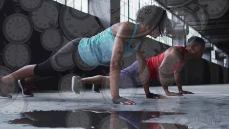 Multiple-stopwatches-falling-against-african-american-man-and-woman-performing-pushup-exercise