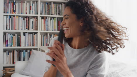 happy-woman-singing-karaoke-at-home-celebrating-having-fun-enjoying-music-on-weekend-4k