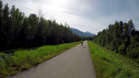 woman jogging on a country road 4k