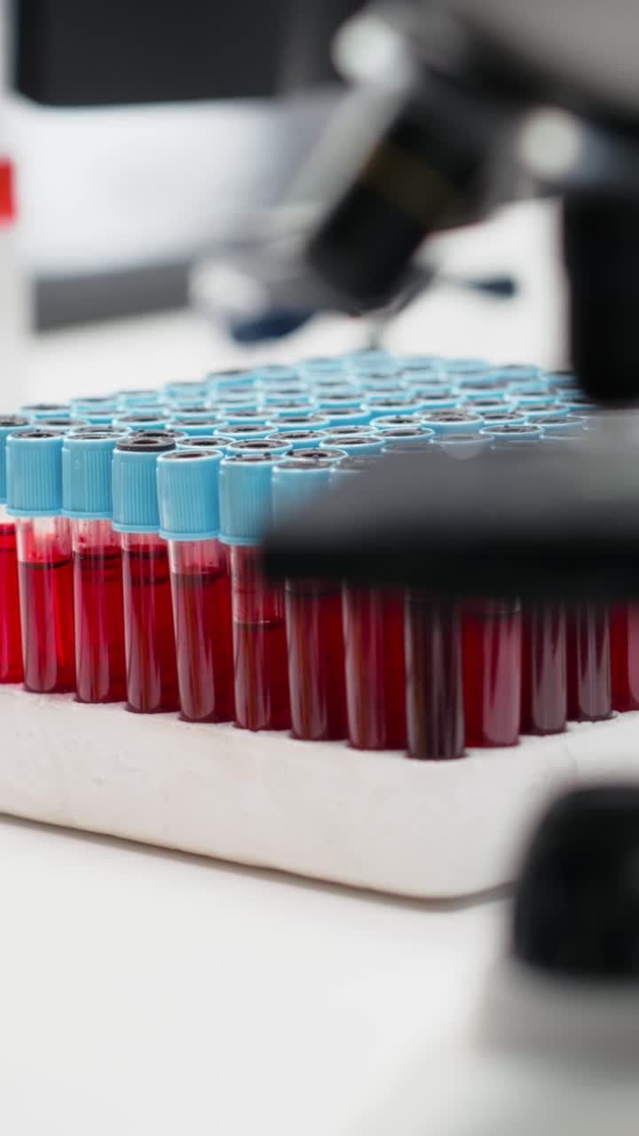 Vertical video Tablet and PC in laboratory displays DNA visualization software