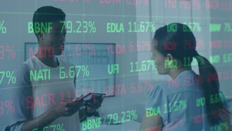 Animation-of-trading-board-over-diverse-female-coworkers-discussing-reports-on-digital-tablet