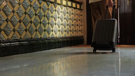 person leaving a hotel