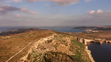 aerial drone video from malta, mellieha area, showing the beautiful landscape on a calm autumn afternoon