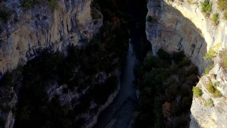 aerial of the osumi canyon in albania, with a river flowing