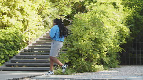 long shot of fat women doing running exercises in nature