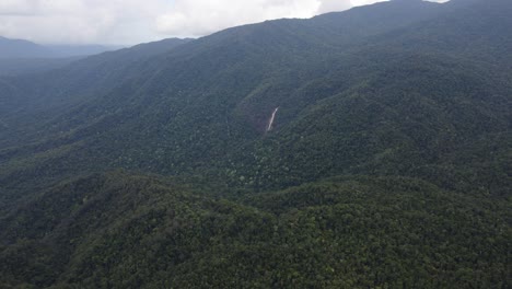 Distance-View-Of-Windin-Falls-In-Tropical-Mountain-Forest-Near-Wooroonooran,-Queensland,-Australia