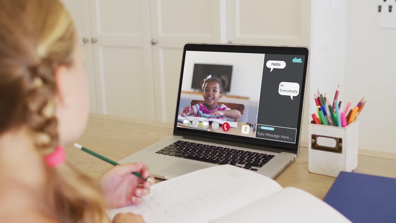 Composite video of girl using laptop for online lesson at home, with diverse schoolgirl on screen