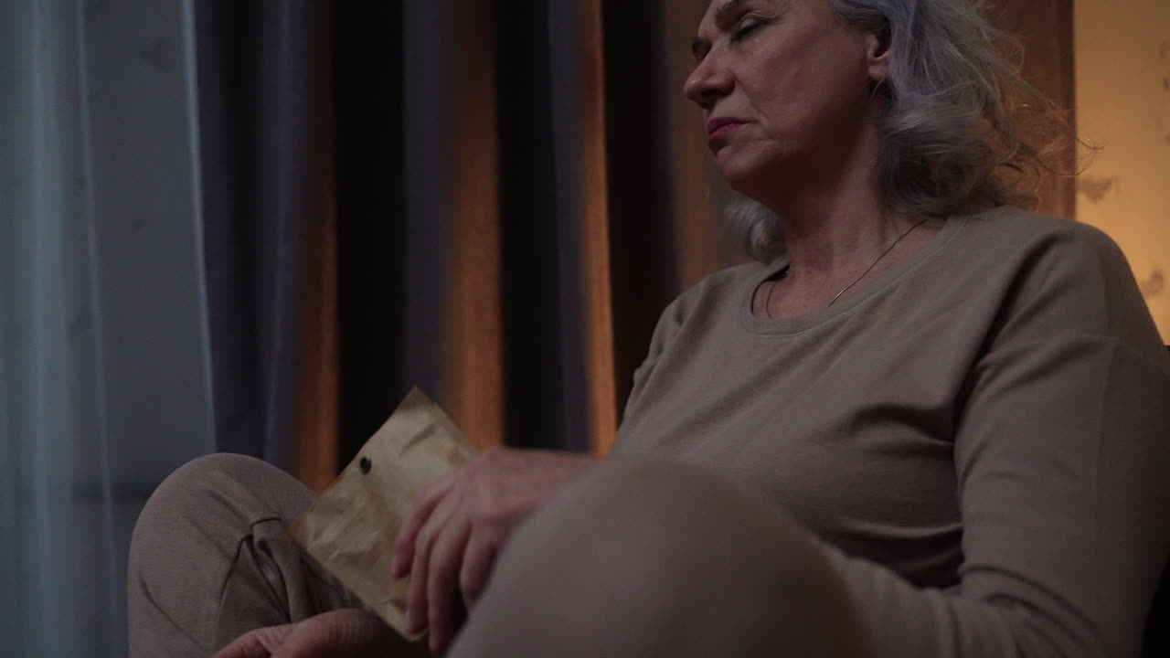 Woman sitting on a chair at night